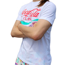 Thumbnail for Coca Cola 90's shirt on model side angle/front view with arms crossed