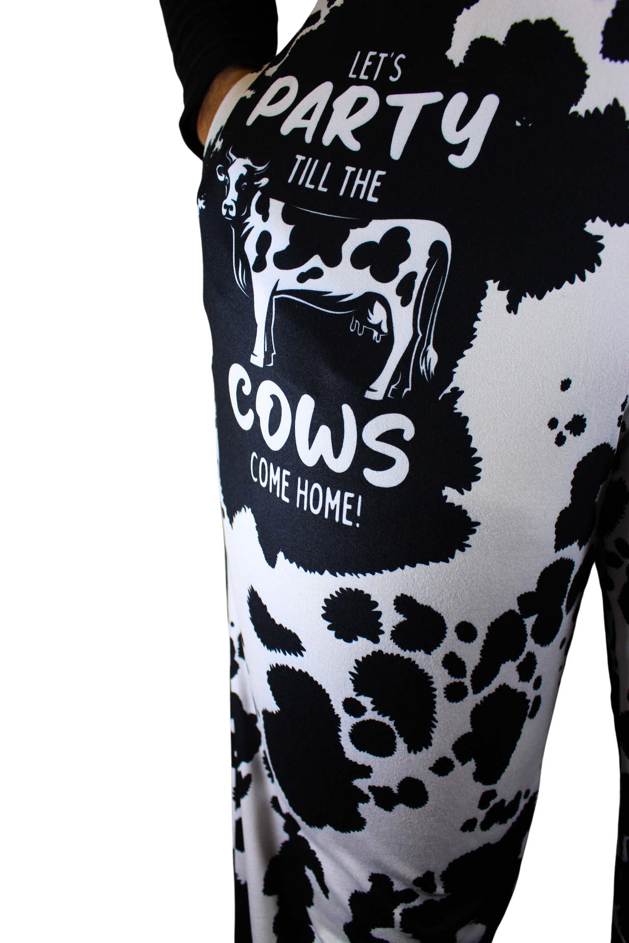 Party 'Till The Cows Come Home pajama lounge pants on model showing one leg (close up front view with hand in pocket)