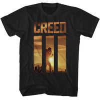 Thumbnail for ROCKY-ROCKY CREED 3 SUNRISE-BLACK ADULT S/S TSHIRT