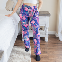 Thumbnail for Female model posing and wearing Flamingo pajama lounge pants (front view)