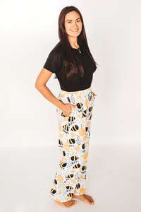 Thumbnail for Image of model posing wearing Honey Bee pajama lounge pants side view (white background)
