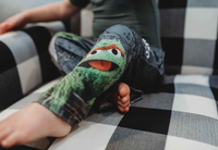 Thumbnail for Close up image of the legs of little girl model wearing Sesame Street Oscar The Grouch pajama lounge pants