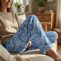 Thumbnail for Close-up of Blue Hydrangea Lounge Pants showing intricate floral pattern in shades of blue and lavender, highlighting fabric texture and color vibrancy on a model.