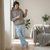 Thumbnail for Person in Bugs Bunny lounge pants, standing or leaning with headphones in a modern room, relaxed and stylish.