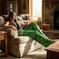 Thumbnail for Full-body of a person lounging in Willie Nelson Lounge Pants in a cozy living room with rustic furniture and textured textiles, natural daylight.