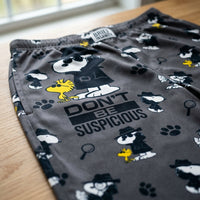 Thumbnail for Macro view of Detective Snoopy Lounge Pants fabric texture showcasing Snoopy and Woodstock print, paw prints, magnifying glasses on charcoal background.