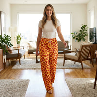 Thumbnail for Cheerful model wearing Pepperoni Lounge Pants in bright home, highlighting loose fit, wide leg design, and vibrant playful print.