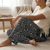 Thumbnail for Relaxed model wearing Detective Snoopy Lounge Pants in a cozy living room, highlighting the loose fit and lightweight fabric details.