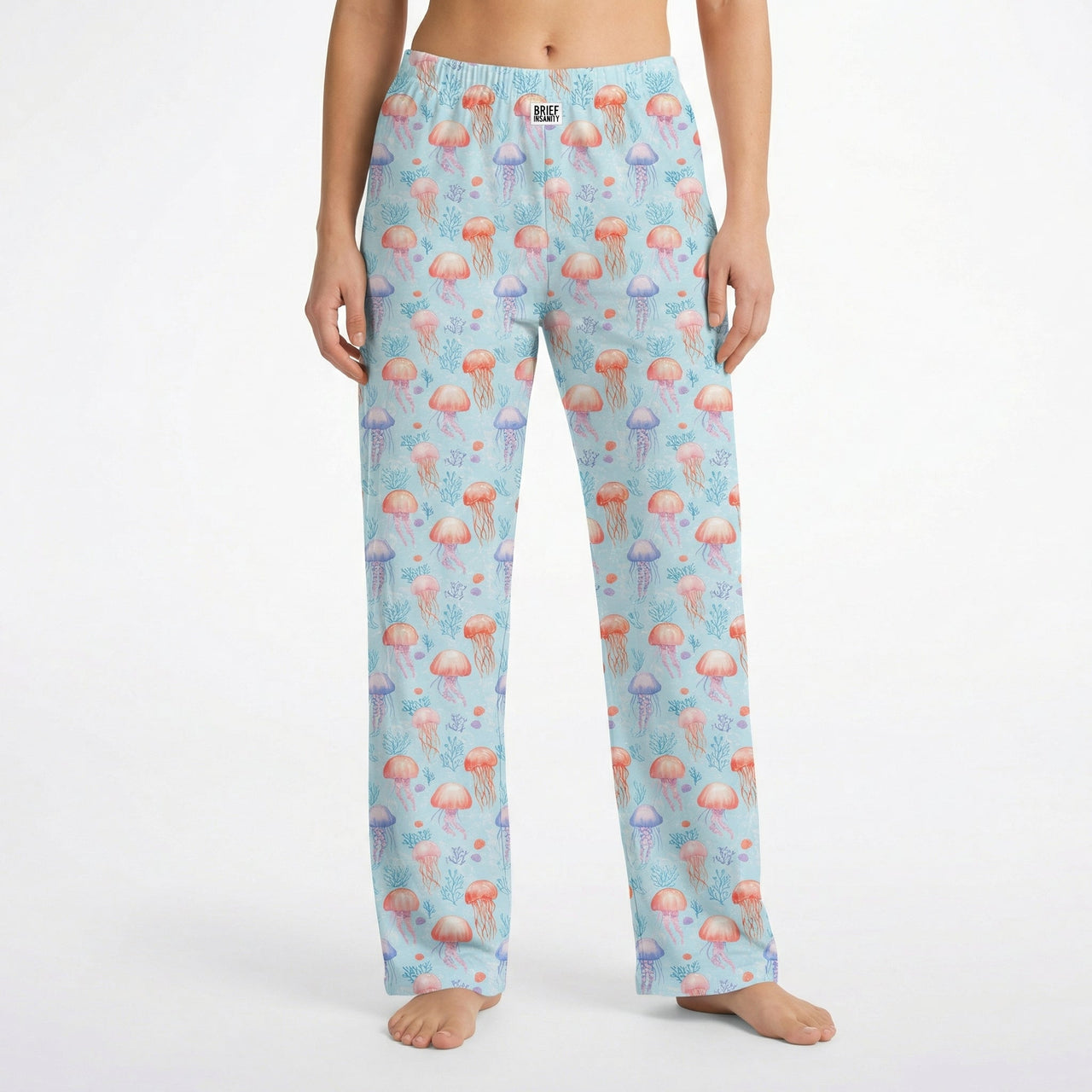 Model wearing Jellyfish Lounge Pants with ocean-inspired pattern, cropped from waist to ankles on white background.