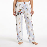 Thumbnail for Relaxed Snoopy lounge pants with beach-inspired design on model against white background.