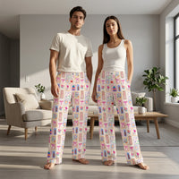 Thumbnail for Full-body shot of models wearing Nurse Doodles Lounge Pants in a cozy living room, highlighting relaxed fit and colorful pattern.