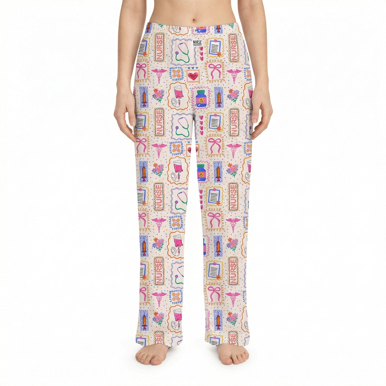 Model wearing Nurse Doodles lounge pants with medical icons on a white background, showcasing vibrant colors and relaxed fit.