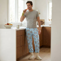 Thumbnail for Individual standing in kitchen wearing Bugs Bunny lounge pants, mid-motion with a snack, casual and playful scene.
