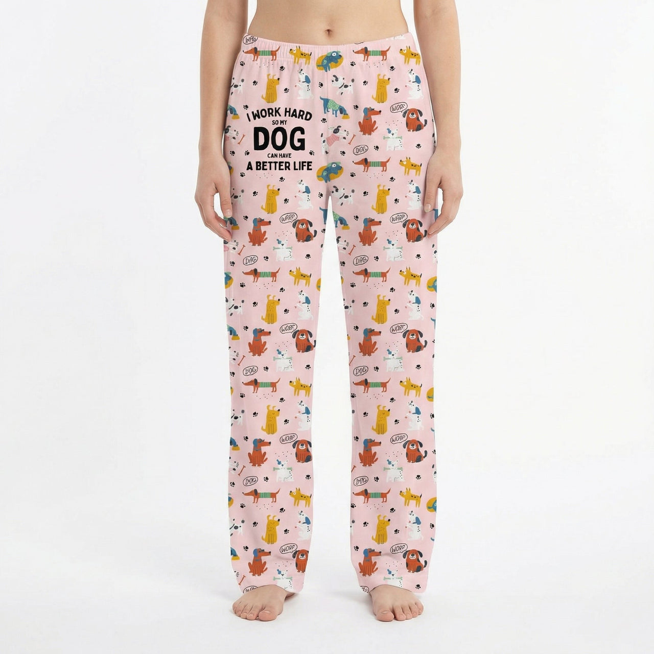 Young woman in playful living room wearing vibrant dog print lounge pants, surrounded by decor and plants.
