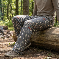 Thumbnail for Full-body outdoor shot of person wearing comfortable Snoopy lounge pants in a natural park setting, highlighting relaxed fit.