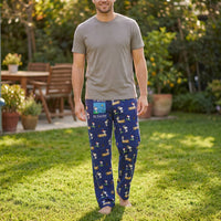 Thumbnail for Male model wearing Snoopy fishing lounge pants in a sunny backyard, showcasing relaxed fit and playful Snoopy print.