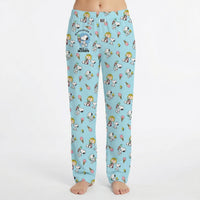 Thumbnail for Model wearing Snoopy Ice Cream Lounge Pants with all-over print of Snoopy and friends enjoying ice cream treats, on a white background.