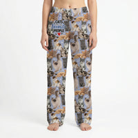 Thumbnail for Model standing in lively living room wearing Cats Favorite People Lounge Pants, vibrant print clearly visible, natural light highlighting colors.
