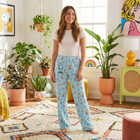 Thumbnail for Young female model in colorful living room wearing Snoopy ice cream lounge pants, relaxed with playful vibe.