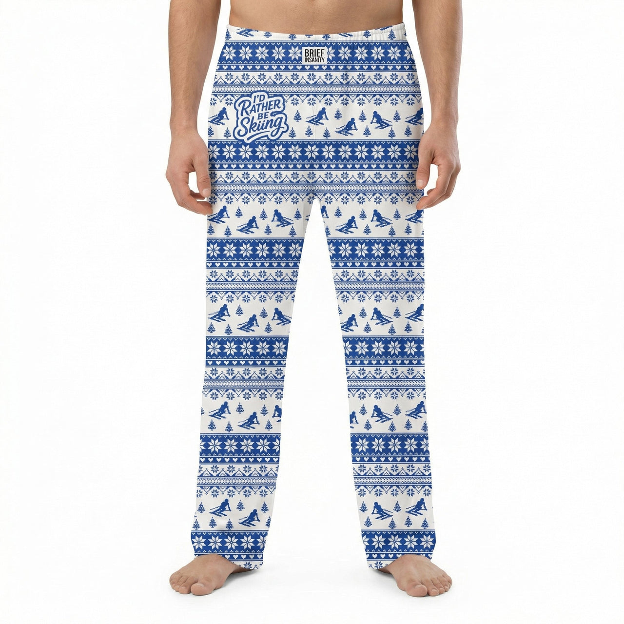 Model wearing I'd Rather Be Skiing lounge pants with snowflakes and pine trees pattern on white background.